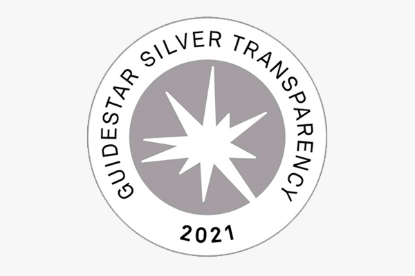 The Guidestar Silver Transparency 2021 logo, gray circle with a white starburst inside.