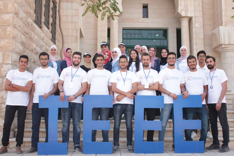 IEEE Student members posing behind the letter I-E-E-E.